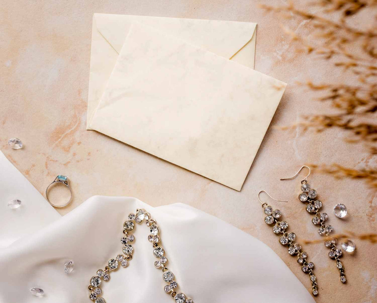 A elegant display of perfect jewelry pieces from SARAH'S WHISPER collections, including necklaces and bracelets on a soft neutral background.