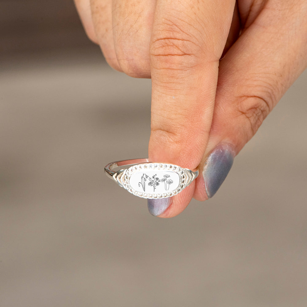 Person wearing wildflowers ring hand shot
