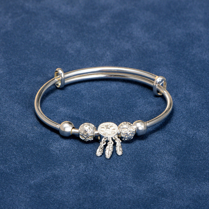 Close-up detail of pendant on granddaughter jewelry