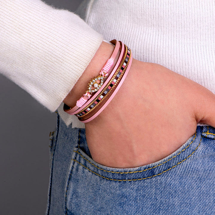 Protection Bracelet featuring PU leather, pearl, and rhinestones, symbolizing safety and elegance.