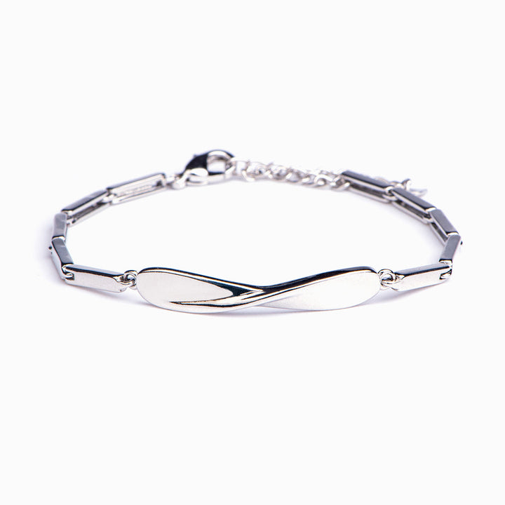 "'Life has its bends and turns' Twist Bracelet featuring symbolic ornament and motivational card, crafted from copper with plating techniques."