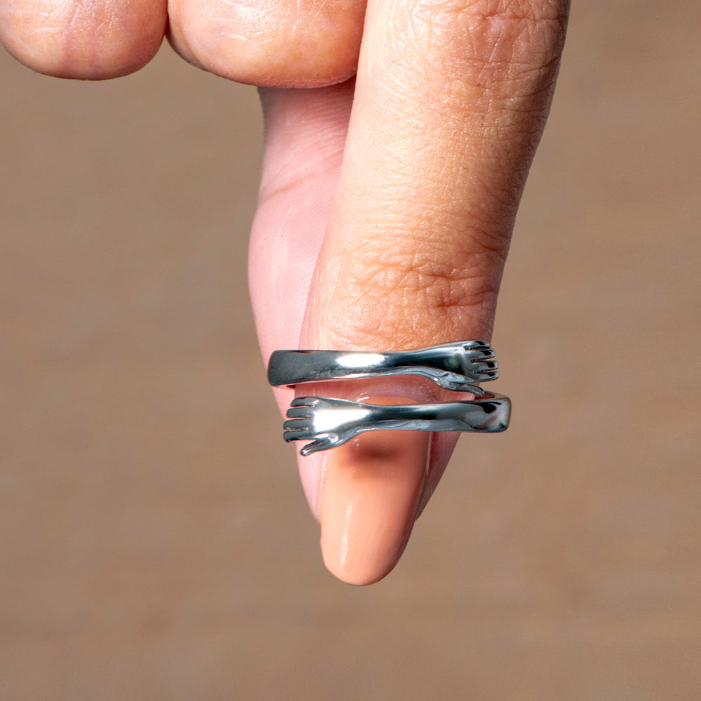 Detailed close-up of the engraving on the mom daughter matching rings.