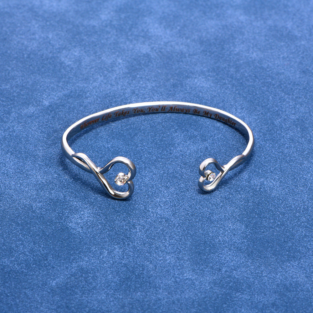 Mother and daughter birthstone bracelet detail showing double heart pendant.