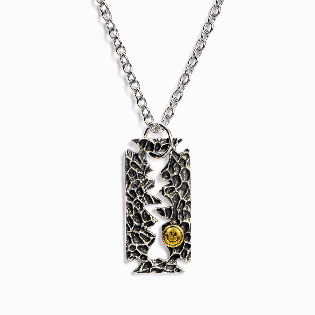 "If you know how to shave the razor, you will know how to erase the eraser." Razor-Blade Necklace