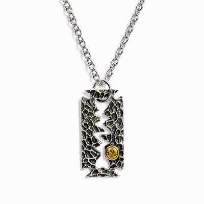 "If you know how to shave the razor, you will know how to erase the eraser." Razor-Blade Necklace