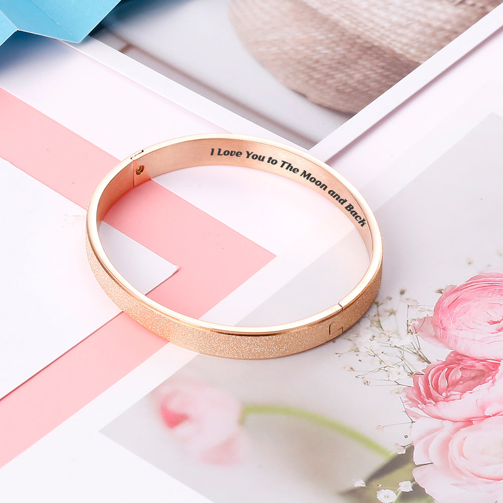 Close-up detail of love message on daughter bracelet