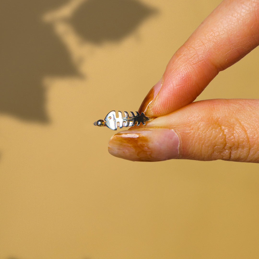 Close-up detail of fishbone design on adjustable ring