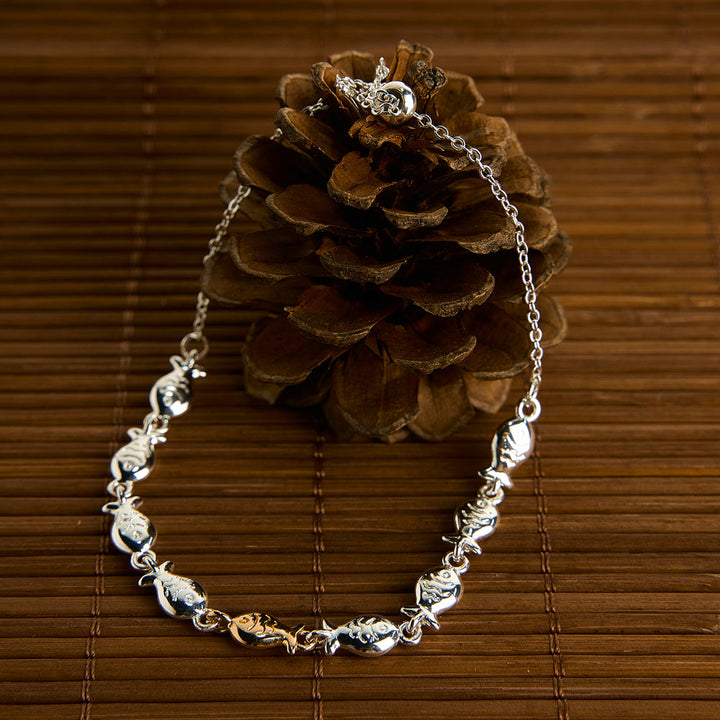 "Be yourself  swimming against the current" Fish Bracelet