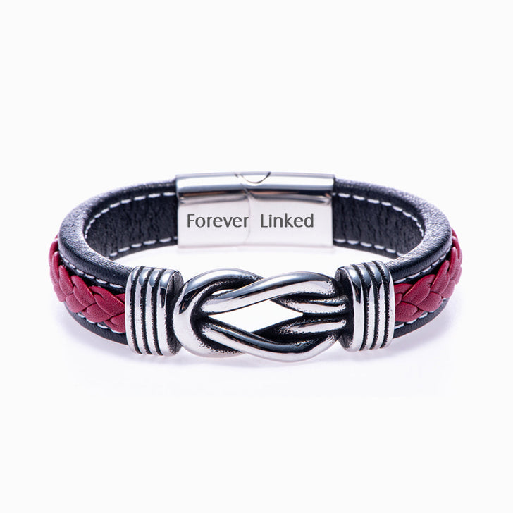 Son bracelet from mom on white background, close-up of leather braid.