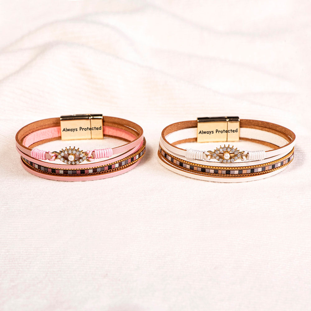 Protection Bracelet featuring PU leather, pearl, and rhinestones, symbolizing safety and elegance.