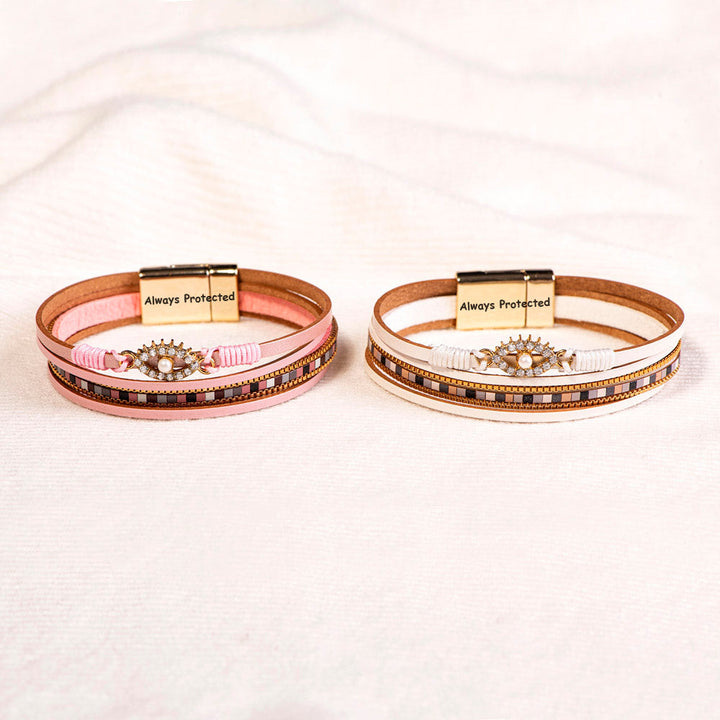 Protection Bracelet featuring PU leather, pearl, and rhinestones, symbolizing safety and elegance.