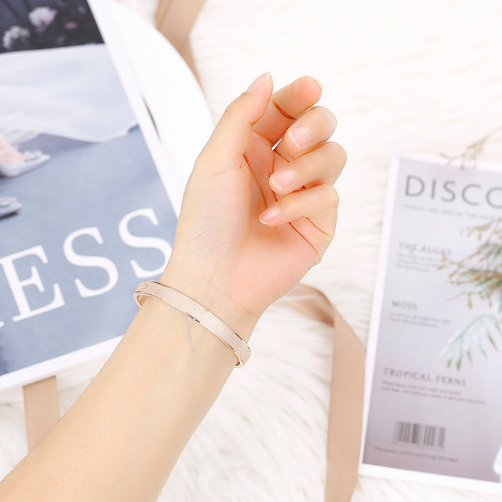 Daughter wearing love bracelet to the moon wrist shot