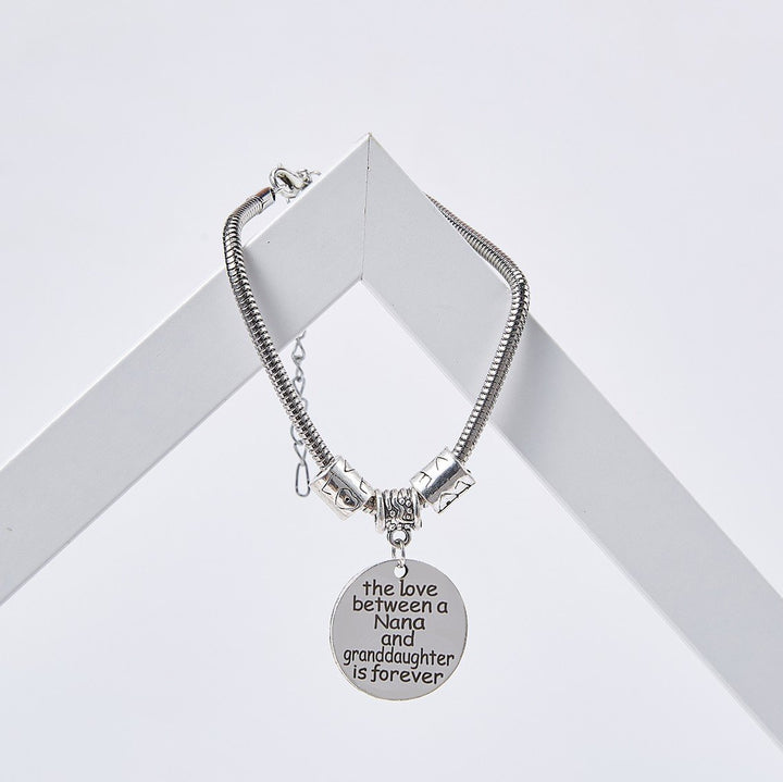 [Custom Name] TO MY GRANDDAUGHTER "THE LOVE BETWEEN A NANA AND GRANDDAUGHTER IS FOREVER" BRACELET - SARAH'S WHISPER
