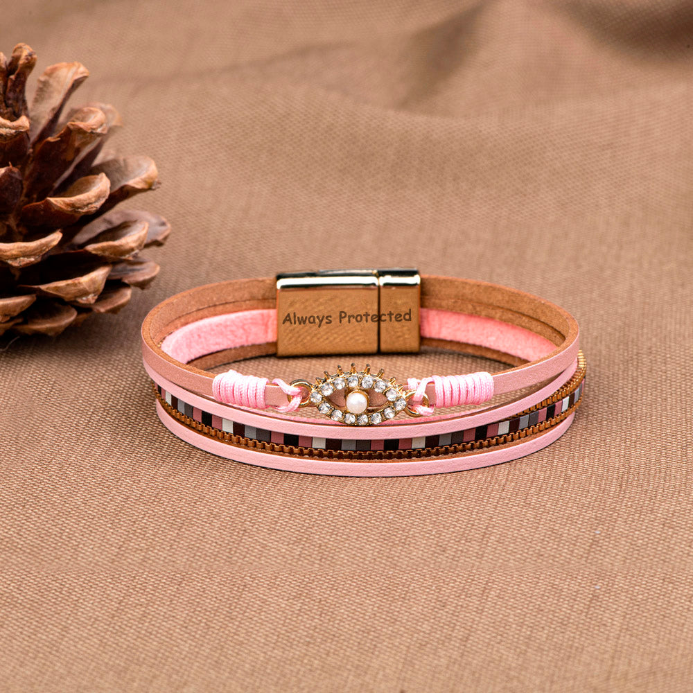 Protection Bracelet featuring PU leather, pearl, and rhinestones, symbolizing safety and elegance.