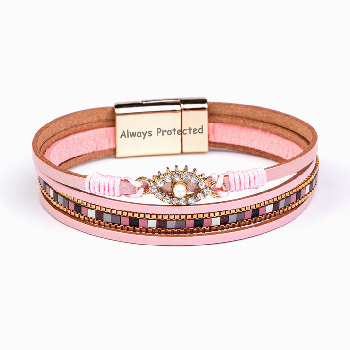 Protection Bracelet featuring PU leather, pearl, and rhinestones, symbolizing safety and elegance.