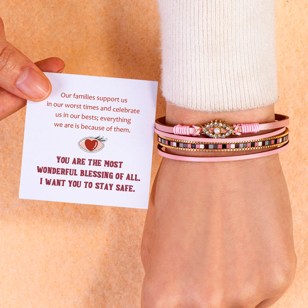 Protection Bracelet featuring PU leather, pearl, and rhinestones, symbolizing safety and elegance.