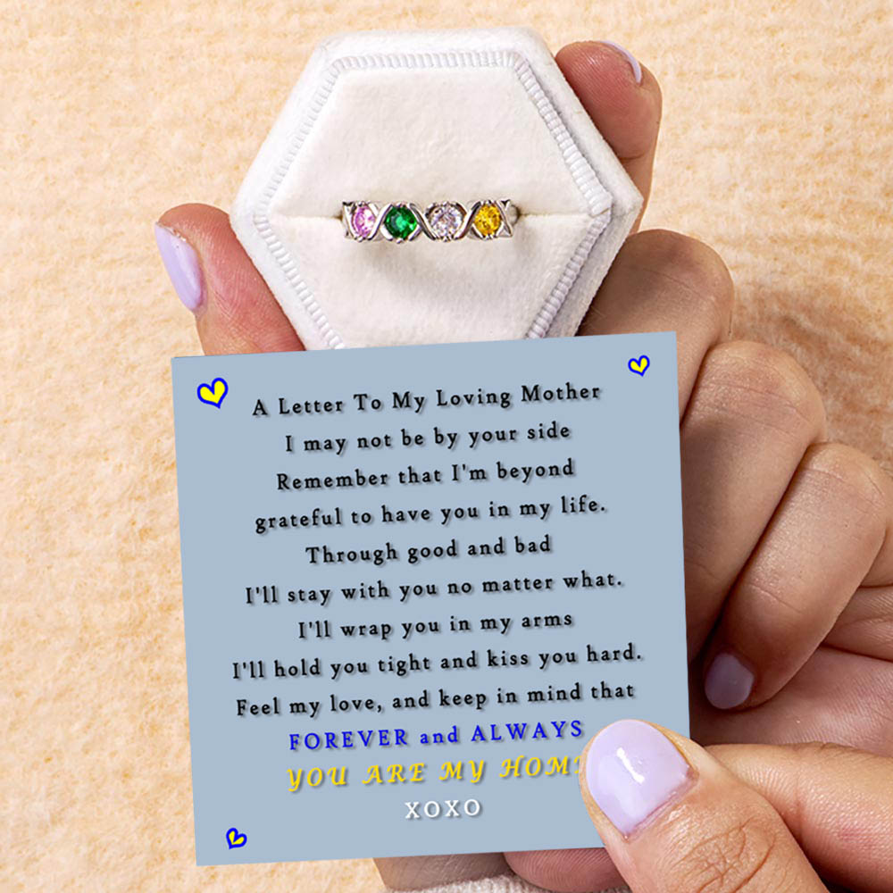 Gift card with heartfelt message beside Mother's Ring